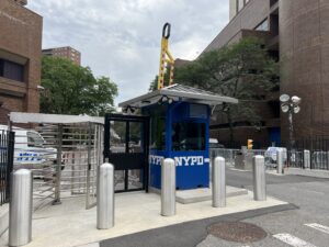 set and pour bollards at NYPD guard booth