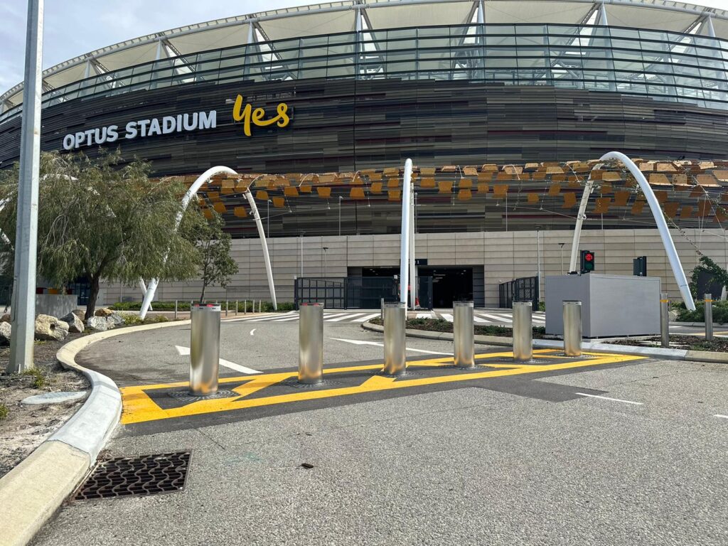 Retractable bollards in front of a stadium. Protecting public spaces.