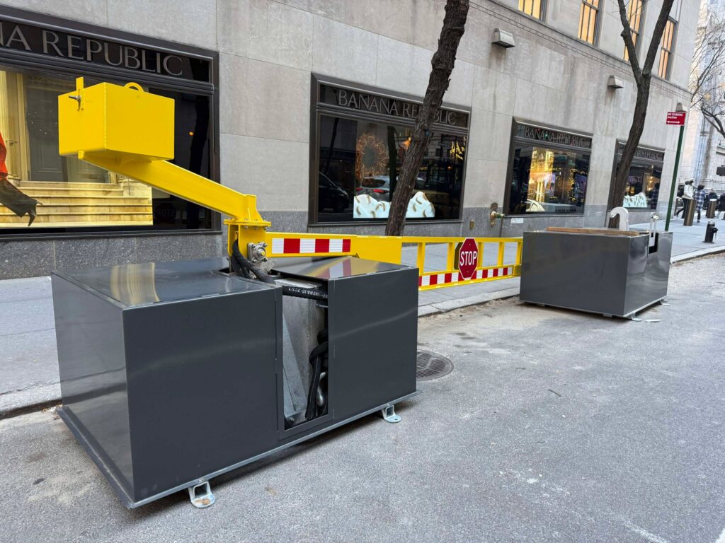 Flexible perimeter security - drop arm barriers unloaded onto the side of the street in NYC.