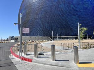 Row of bollards with stainless steel bollard covers in front of the Sphere in Las Vegas.