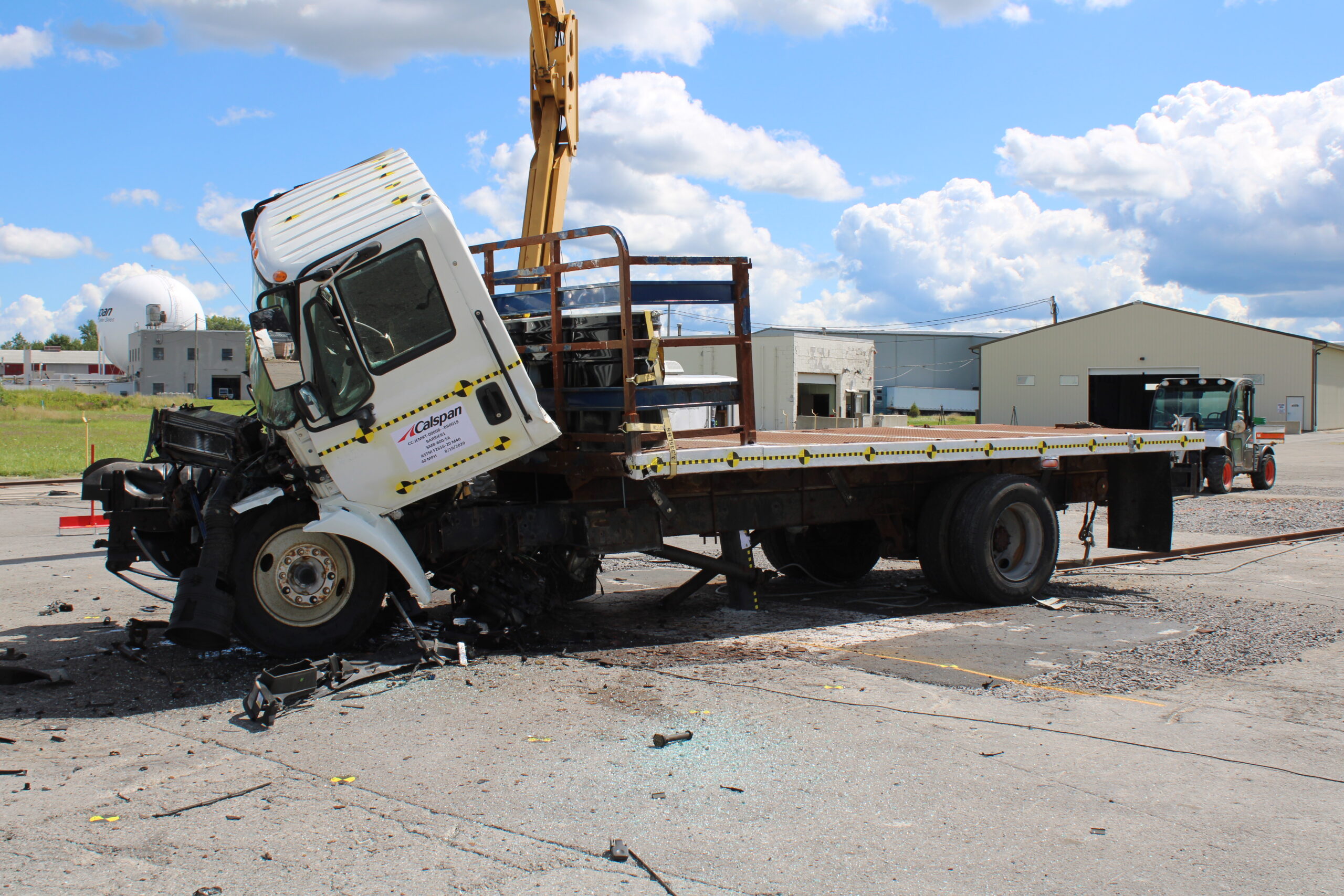 Crash test photo of a 15,000 lb truck crashed into a bollard