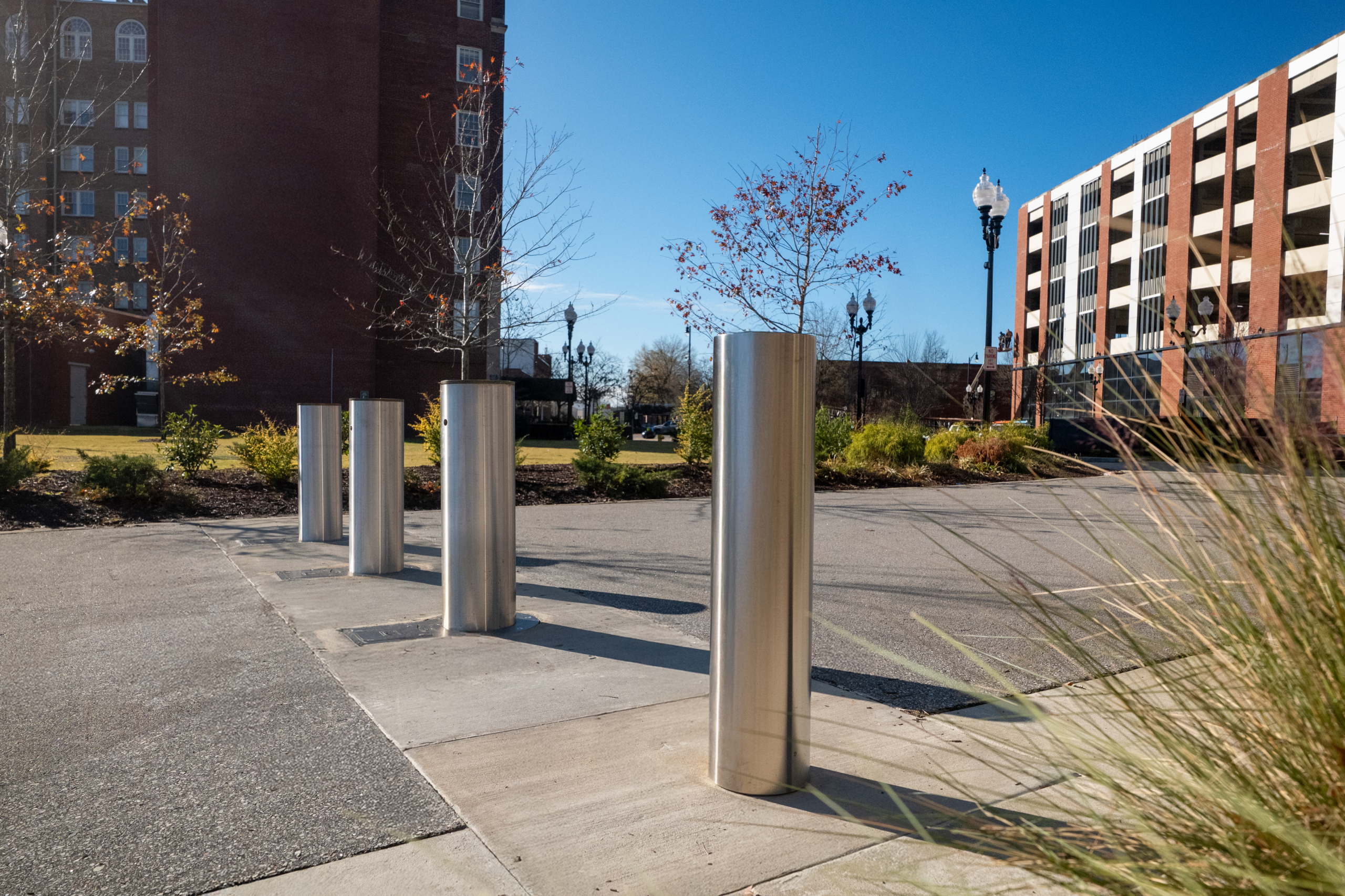 row of bollards in front of a stadium