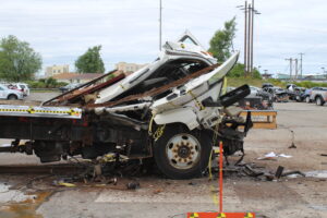 ASTM F2656 crash test showing destroyed medium duty truck stopped by a Barrier1 vehicle security barrier